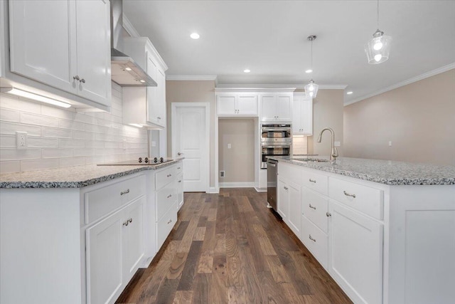 kitchen featuring sink, dark hardwood / wood-style flooring, pendant lighting, a center island with sink, and white cabinets