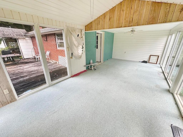 unfurnished sunroom with ceiling fan, lofted ceiling, and wooden ceiling