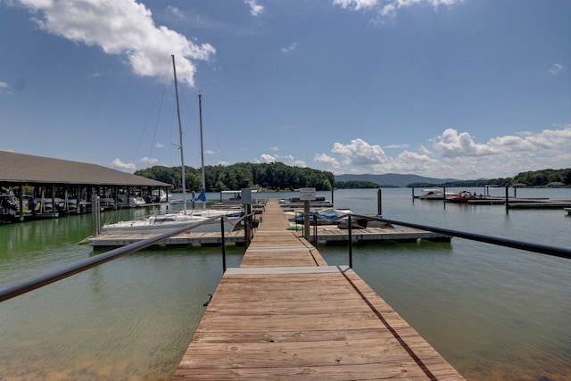 dock area featuring a water and mountain view