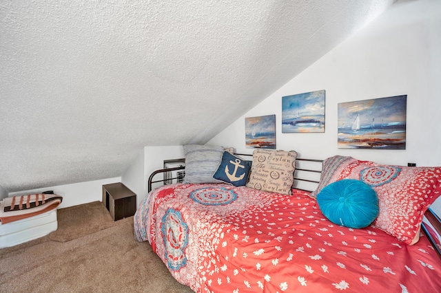 carpeted bedroom with lofted ceiling and a textured ceiling