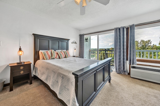 carpeted bedroom with ceiling fan, a textured ceiling, and access to outside