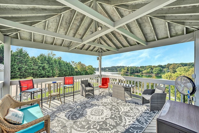 view of patio / terrace featuring a deck with water view and a gazebo