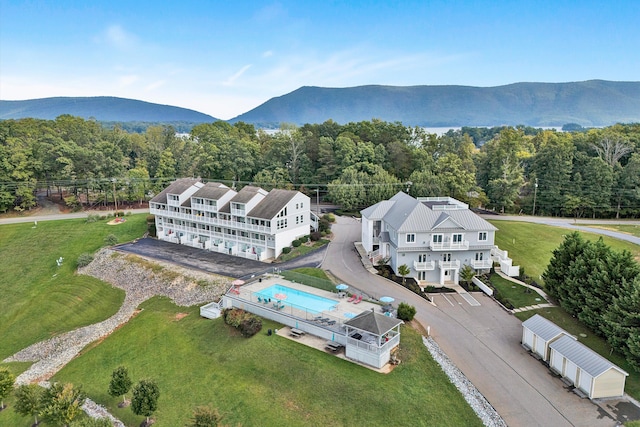 birds eye view of property with a mountain view