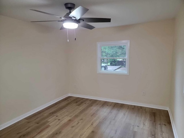 unfurnished room featuring light hardwood / wood-style floors and ceiling fan