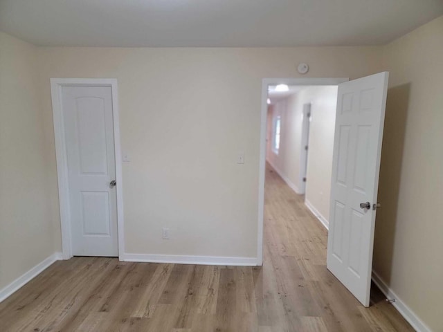 spare room featuring light wood-type flooring