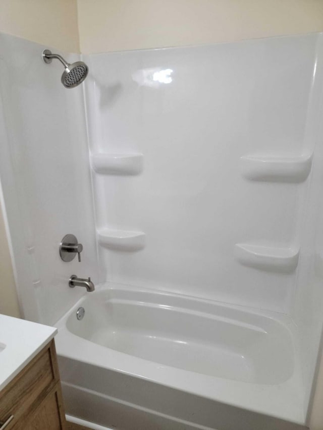 bathroom featuring vanity and shower / washtub combination