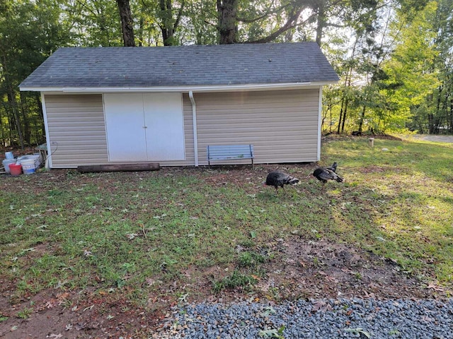 view of outdoor structure featuring a yard