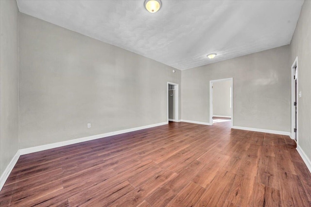 spare room featuring dark hardwood / wood-style floors