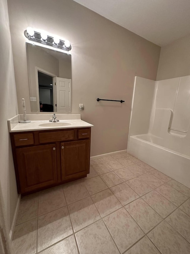 bathroom featuring tile patterned floors, independent shower and bath, and vanity