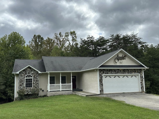 ranch-style home featuring a front yard, a porch, and a garage