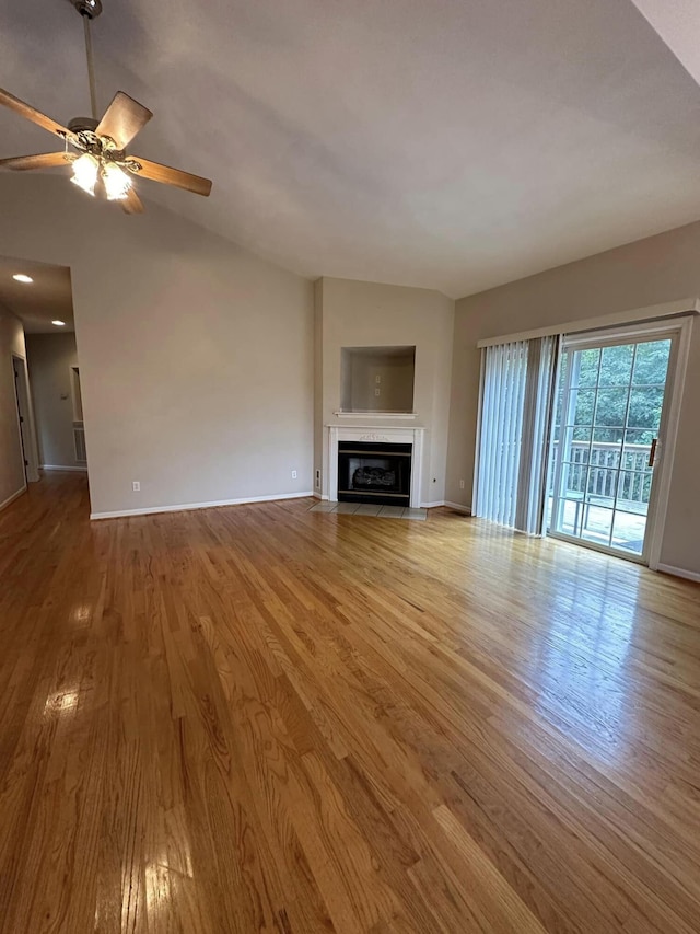 unfurnished living room with ceiling fan and light wood-type flooring