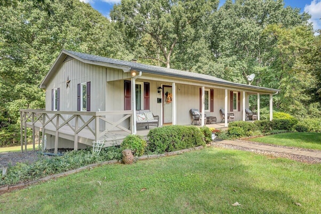 view of front of property with a front yard and a porch