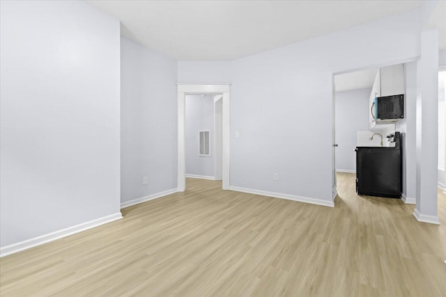 interior space featuring light hardwood / wood-style floors and sink