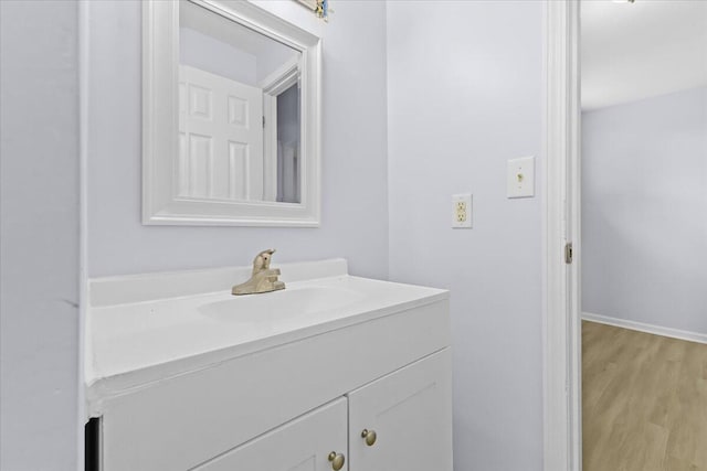 bathroom with wood-type flooring and vanity