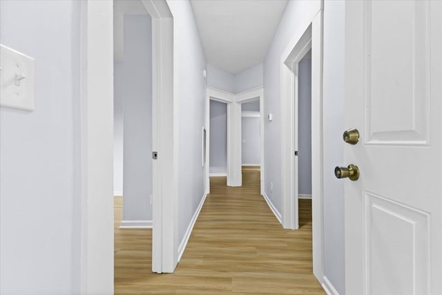 hallway with light wood-type flooring