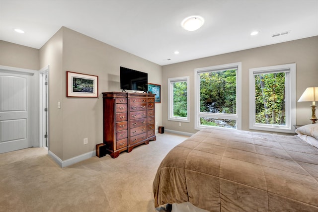 bedroom with light colored carpet