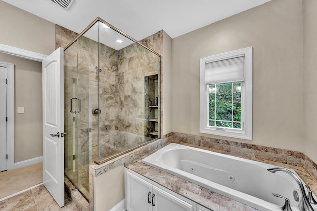 bathroom with shower with separate bathtub