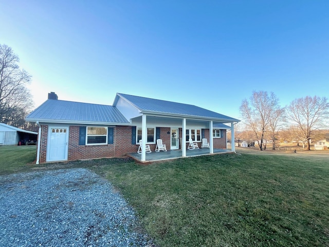 ranch-style house with a porch and a front yard