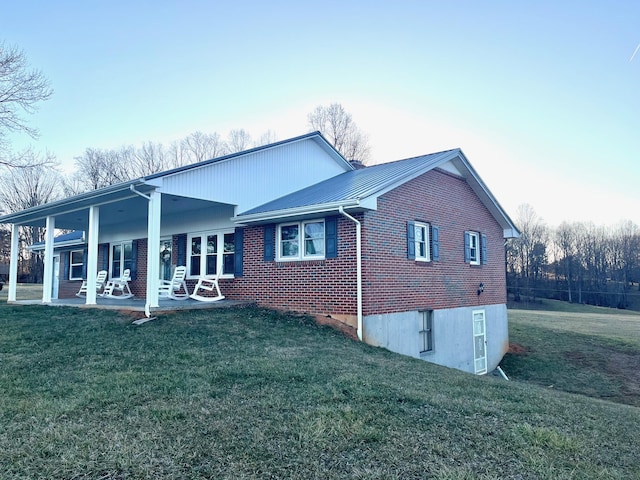 exterior space with a porch and a yard