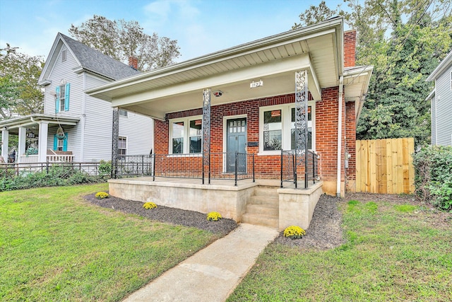 view of front of property with a front lawn and a porch