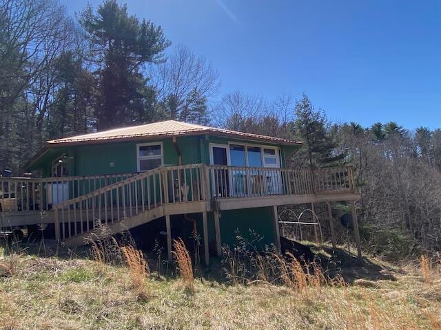 rear view of property with a deck