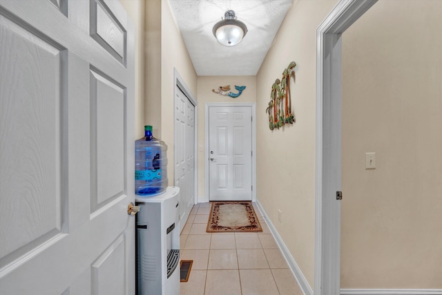 doorway to outside featuring light tile patterned floors