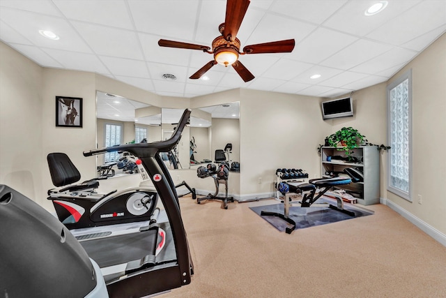 exercise room featuring carpet floors, ceiling fan, and plenty of natural light