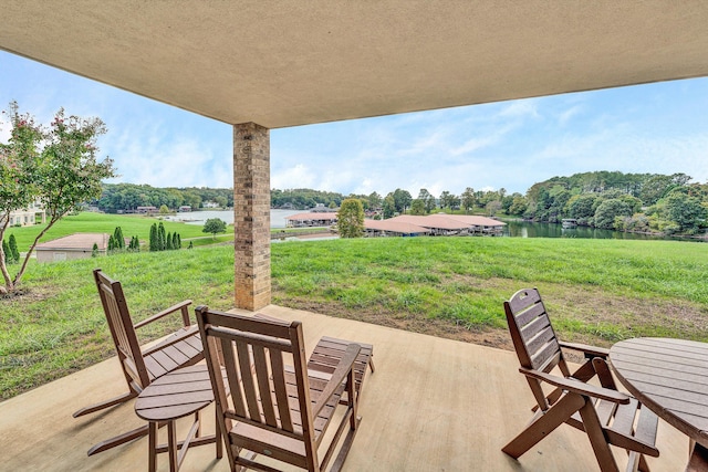 view of patio featuring a water view