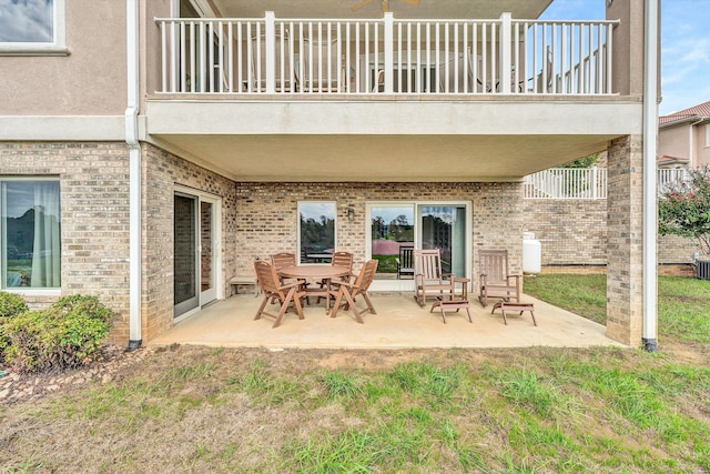 view of patio / terrace featuring a balcony and central AC unit