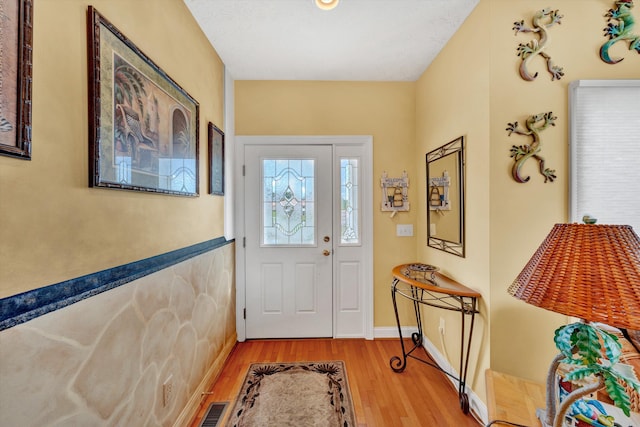 foyer with light wood-type flooring