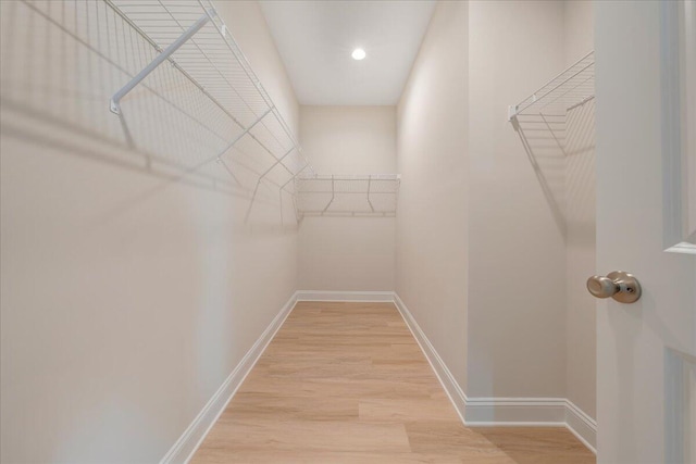 walk in closet featuring light wood-style floors