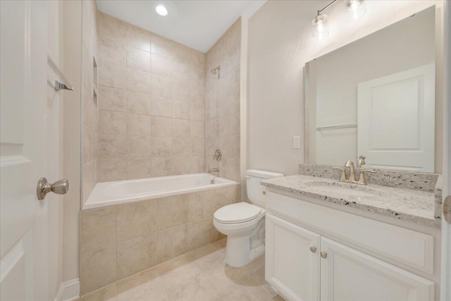 full bathroom with tiled shower / bath combo, vanity, toilet, and tile patterned floors