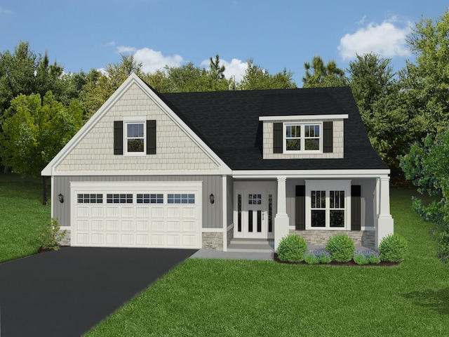 view of front of home with covered porch, a front yard, and a garage