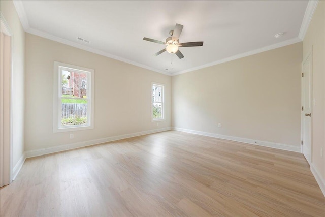 unfurnished room featuring light wood-type flooring, ornamental molding, and plenty of natural light