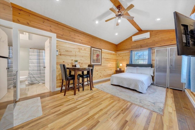 bedroom with ceiling fan, light hardwood / wood-style floors, wooden walls, vaulted ceiling, and an AC wall unit