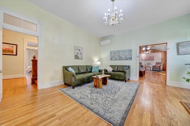 living room featuring ceiling fan with notable chandelier, lofted ceiling, hardwood / wood-style floors, and a wall mounted AC