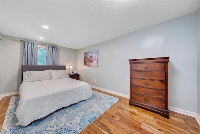 bedroom with light wood-type flooring