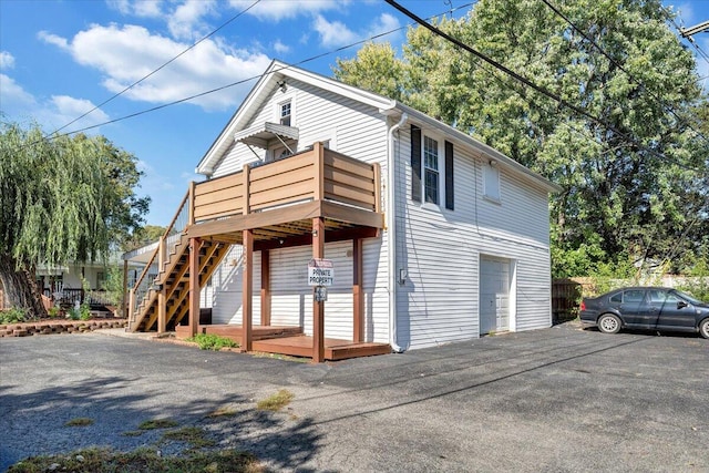 view of property exterior with a deck