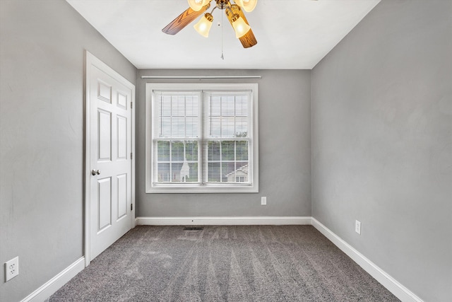 carpeted empty room featuring ceiling fan