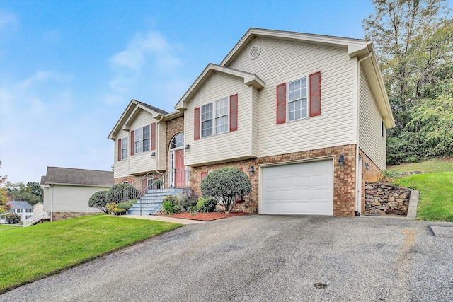 bi-level home featuring a front lawn and a garage