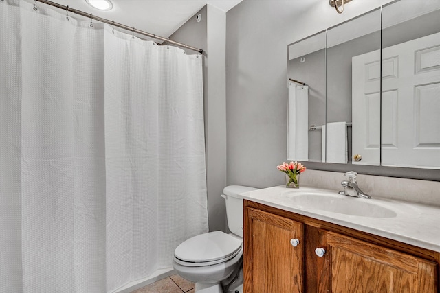 bathroom with a shower with shower curtain, tile patterned floors, vanity, and toilet