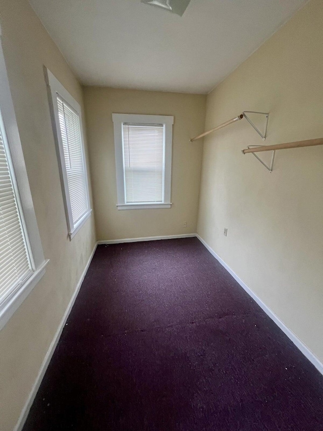 spare room featuring carpet