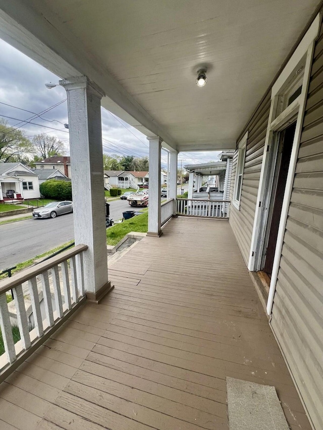 wooden terrace with a porch