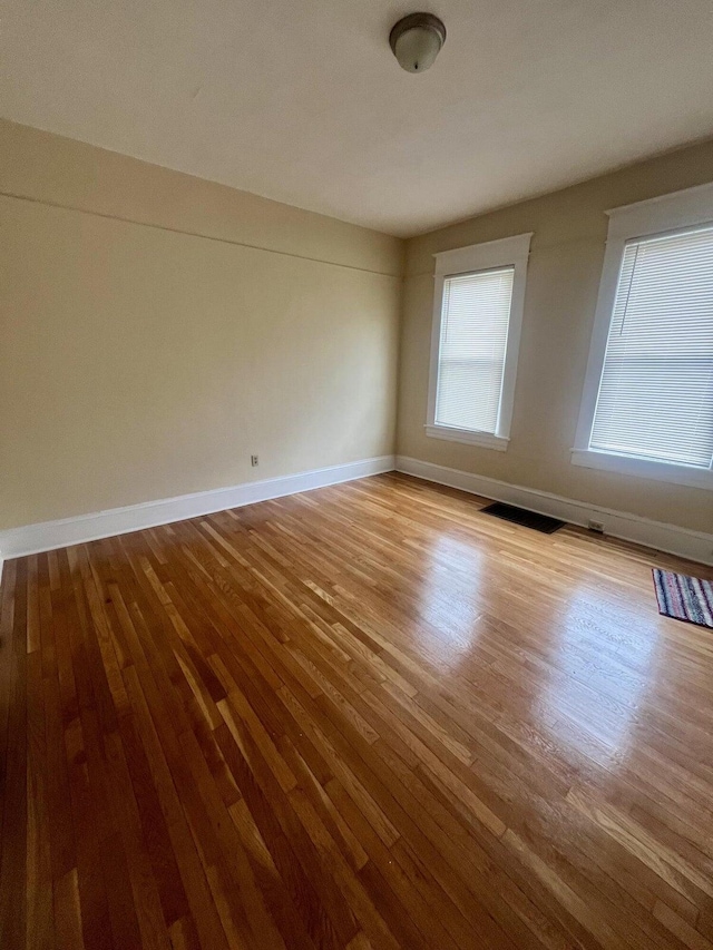 unfurnished room featuring light wood-type flooring