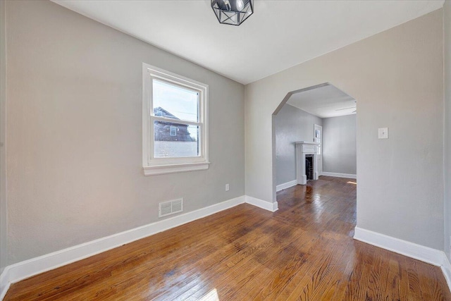 additional living space with dark hardwood / wood-style floors