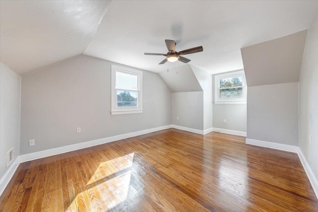 additional living space featuring lofted ceiling, wood-type flooring, and ceiling fan