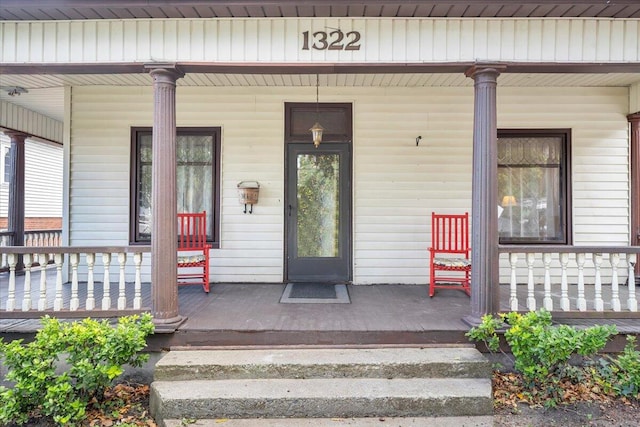 doorway to property featuring covered porch