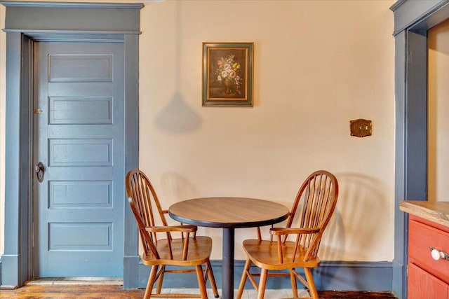 dining area with hardwood / wood-style flooring