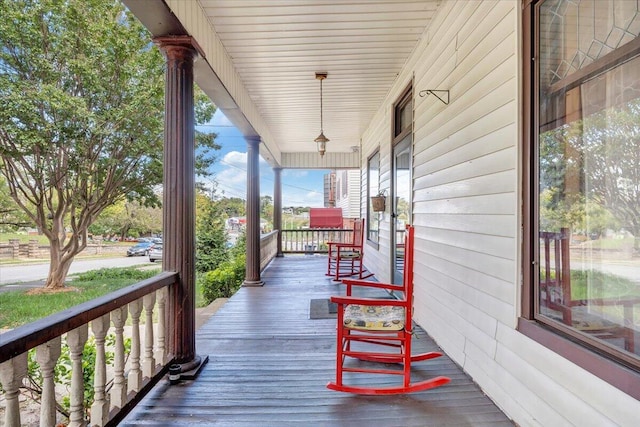 wooden terrace featuring a porch