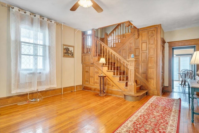 interior space featuring hardwood / wood-style floors, ceiling fan, and plenty of natural light